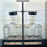 K09. Glass and silverplate decanter set. 